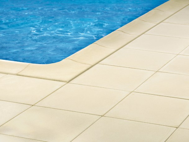 Smooth Fouras pool coping stones in buff colour with matching paving